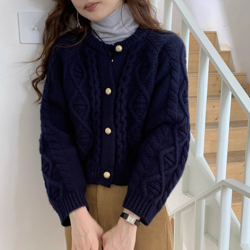 Damesvest met kabelpatroon en goudkleurige knopen, marineblauw