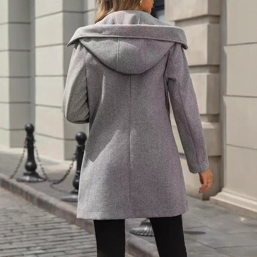 Korte double-breasted damesmantel met reverskraag en zakken