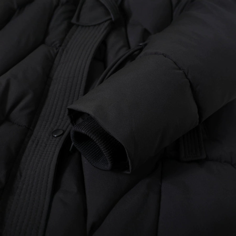 Lange gewatteerde winterjas voor dames met capuchon en imitatiebontafwerking, warme winterparka