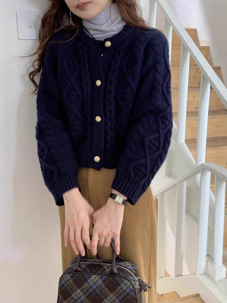 Damesvest met kabelpatroon en goudkleurige knopen, marineblauw