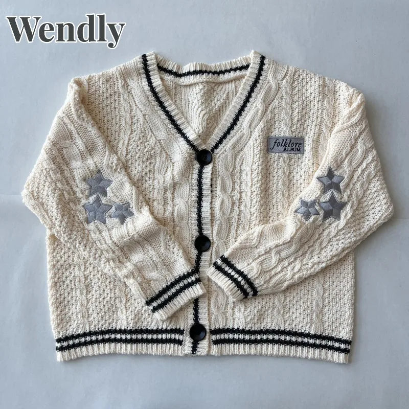 Damesvest beige met V-hals, kabelpatroon en sterrenapplicaties