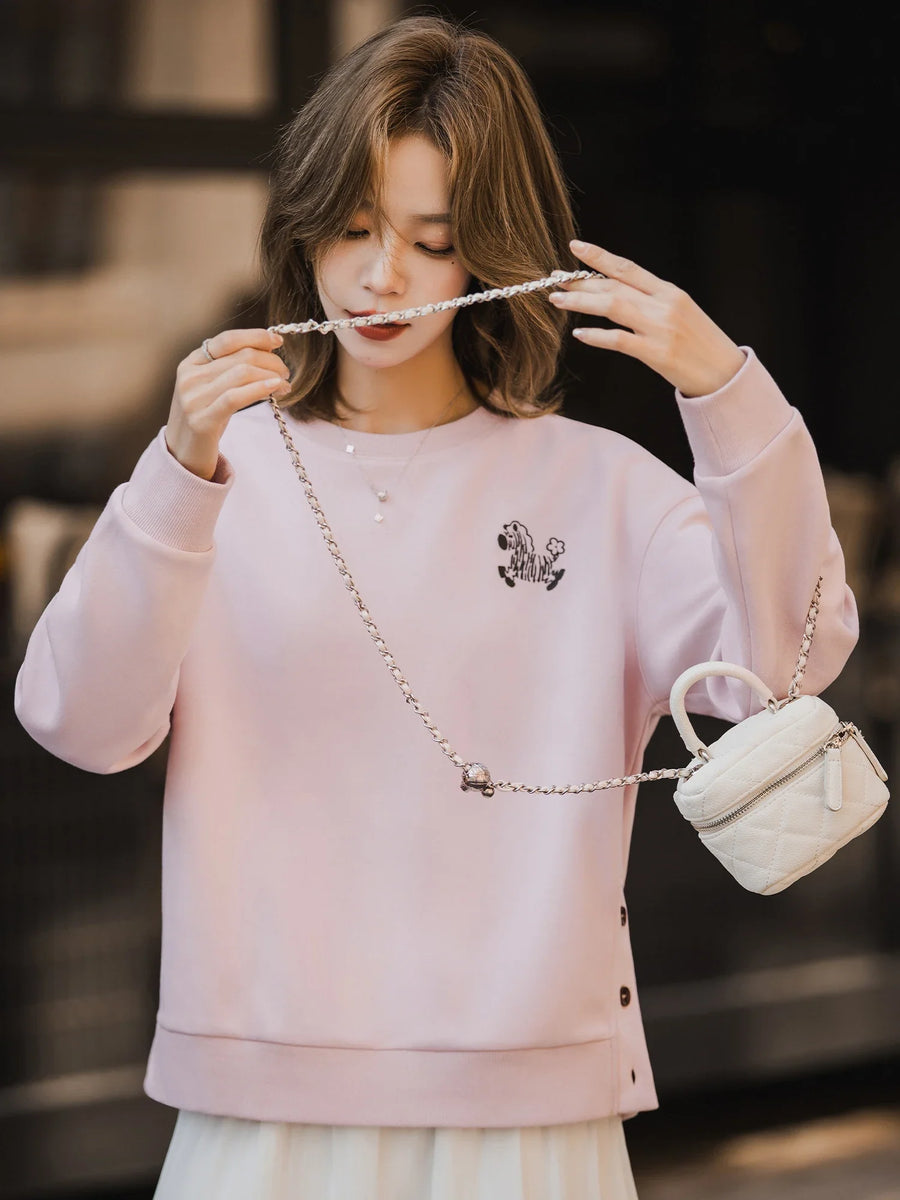 Dames sweatshirt geel met zebraborduursel en knopen aan de zijkant