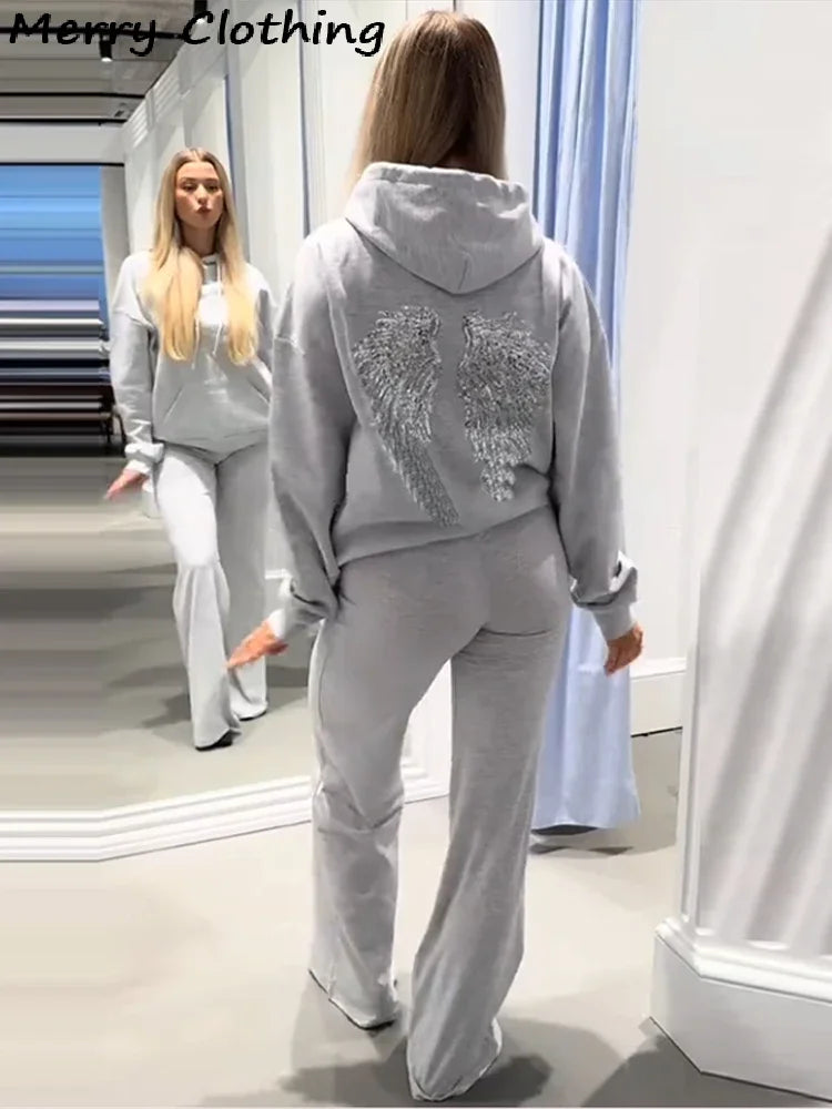 Dameshoodie met paillettenvleugels op de rug, losse pasvorm