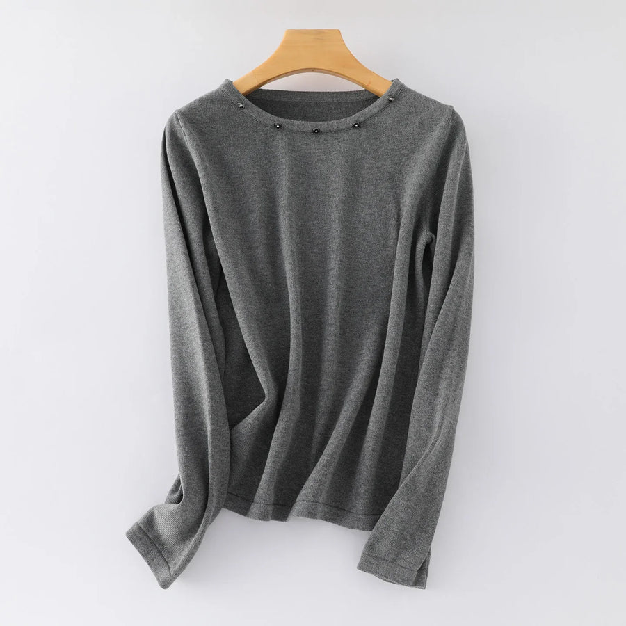 Damesshirt met lange mouwen, ronde hals en sierknopen