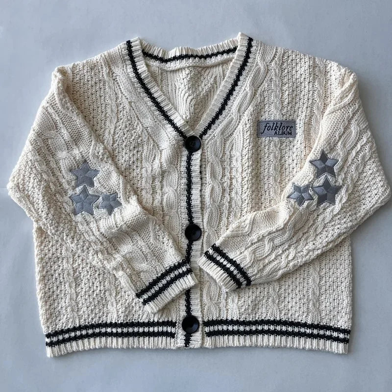 Damesvest beige met V-hals, kabelpatroon en sterrenapplicaties