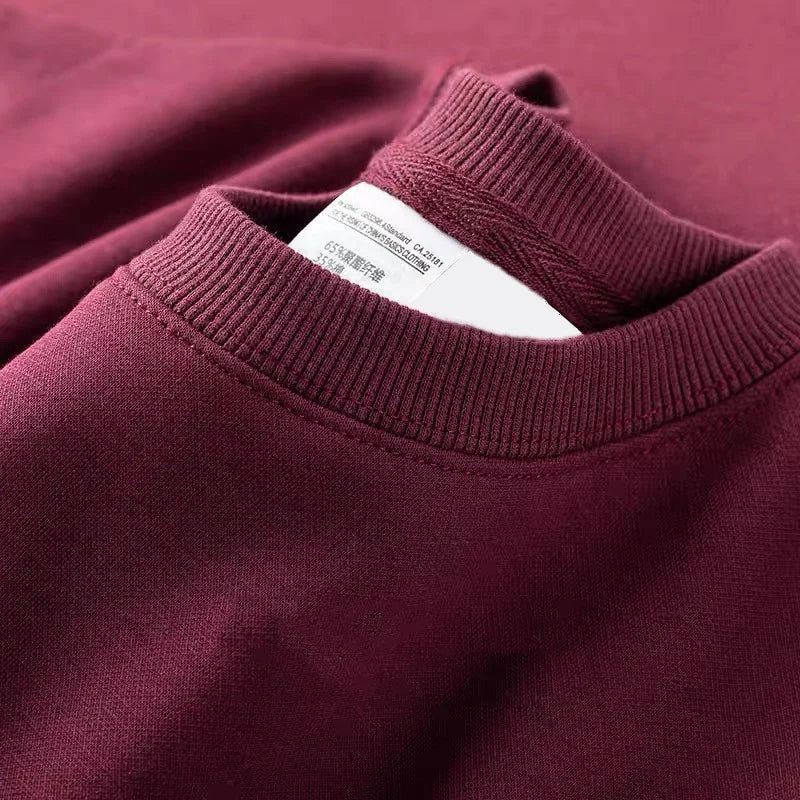 Unisex sweater met lange mouwen en ronde hals, gevoerd met fleece