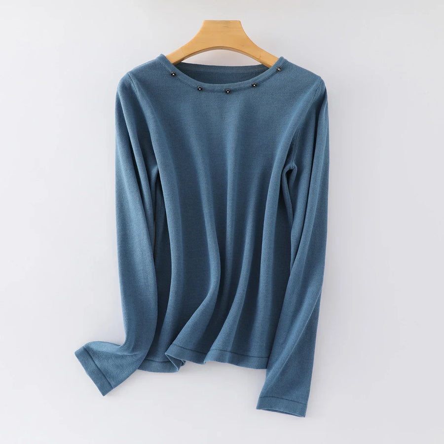 Damesshirt met lange mouwen, ronde hals en sierknopen