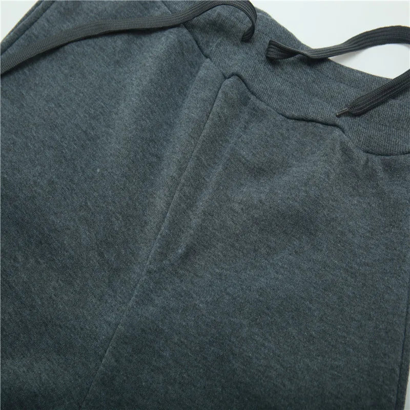 Uniseks joggingbroek van fleece, warm voor de winter, met boorden, zijzakken en trekkoord, zwart grijs wit