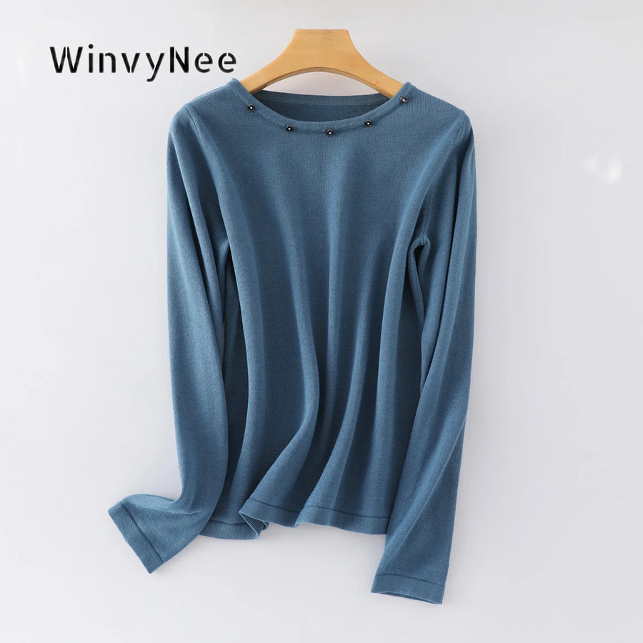 Damesshirt met lange mouwen, ronde hals en sierknopen