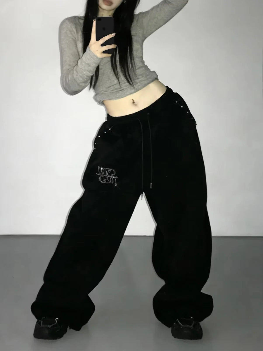 Zwarte wijde joggingbroek voor dames met glitterapplicatie