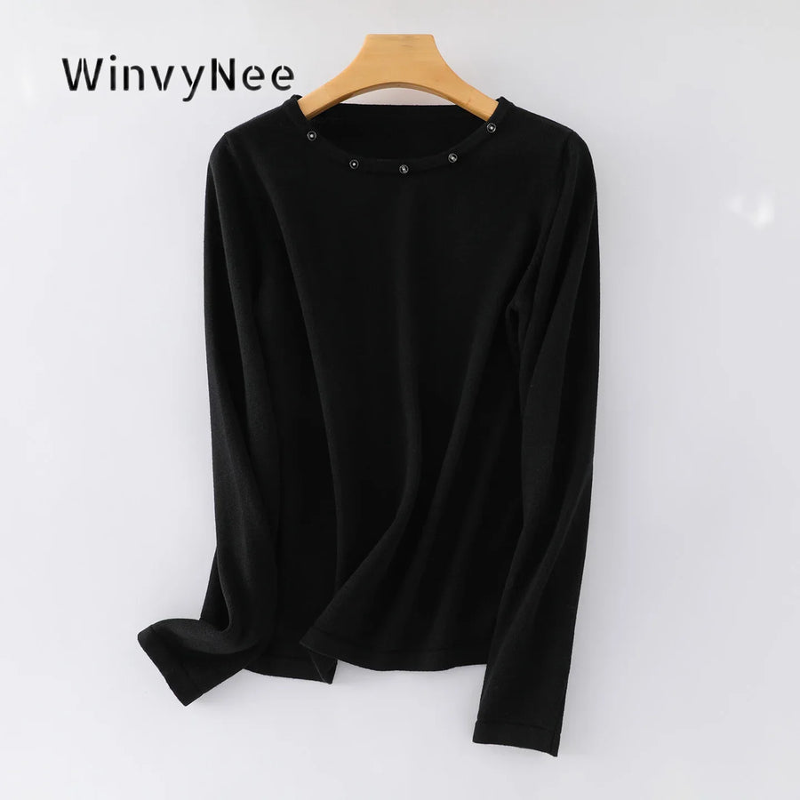 Damesshirt met lange mouwen, ronde hals en sierknopen