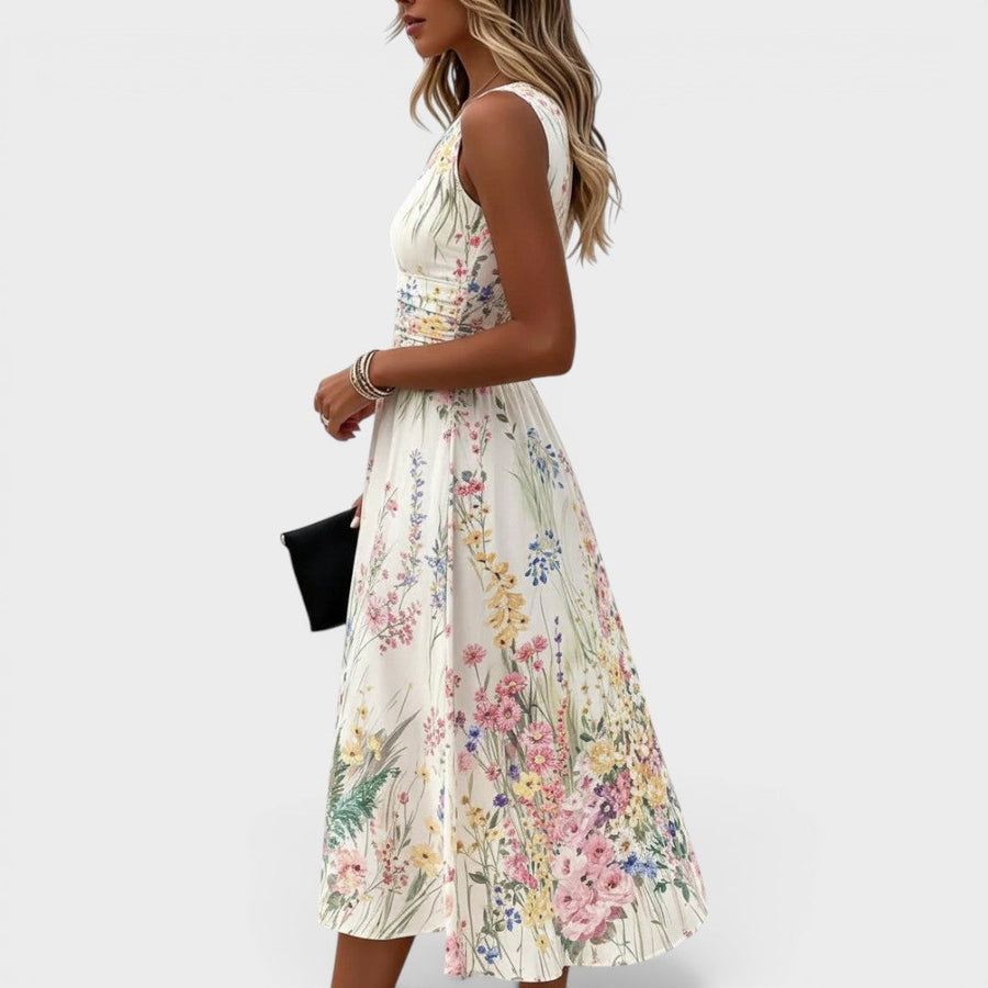 Witte mouwloze dameszomerjurk met bloemenprint en ronde hals