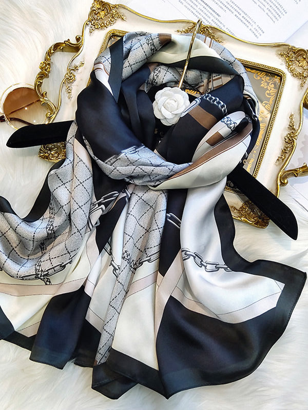 Dameshalsdoek met kettingmotief en kwastjesdetails in verschillende kleuren