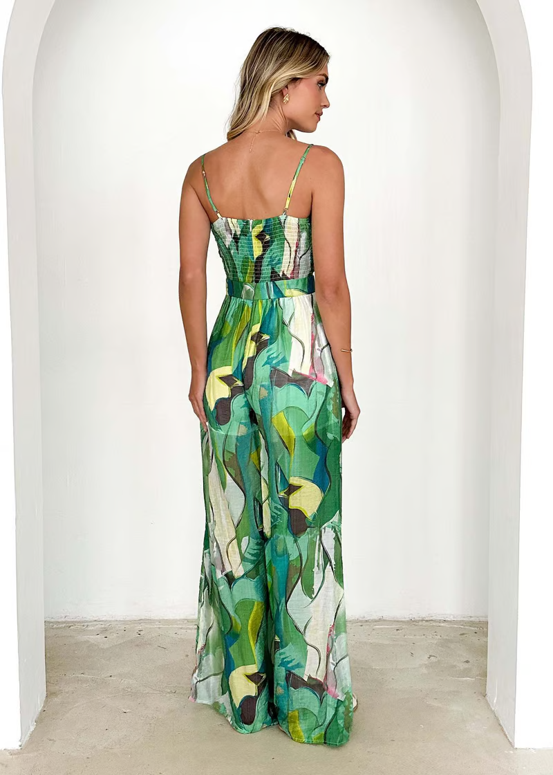 Damesjumpsuit met wijde pijpen, bustier en groen bladpatroon