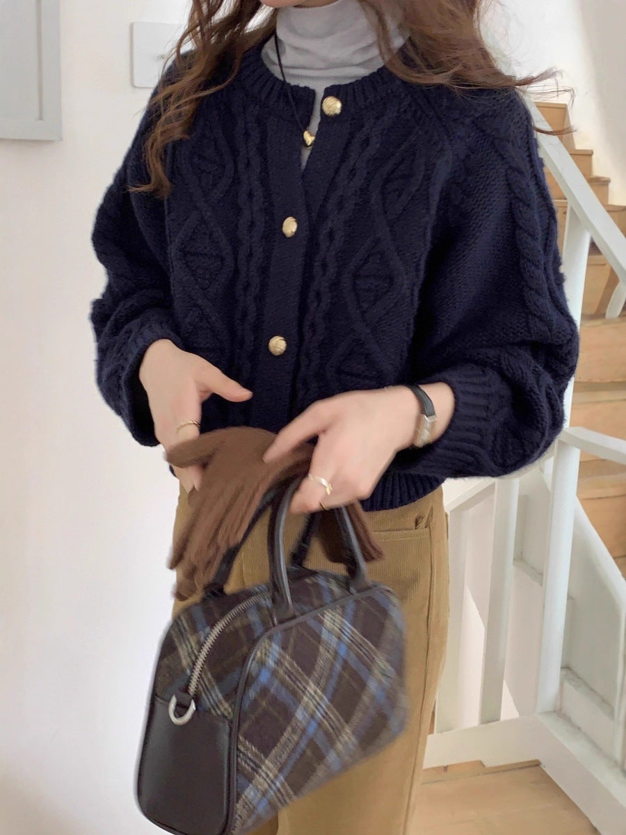 Damesvest met kabelpatroon en goudkleurige knopen, marineblauw