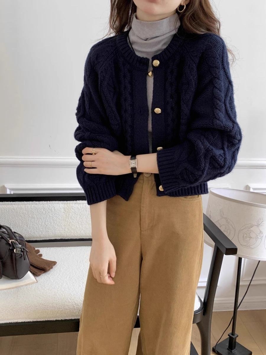 Damesvest met kabelpatroon en goudkleurige knopen, marineblauw