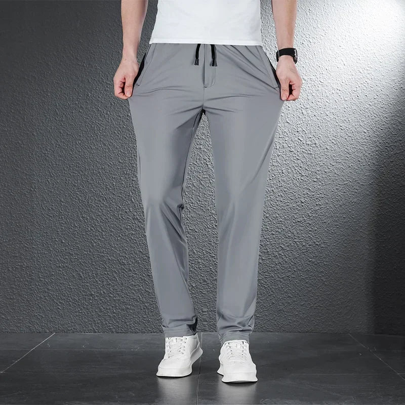 Vrijetijdsbroek voor heren met elastische tailleband en zak met rits