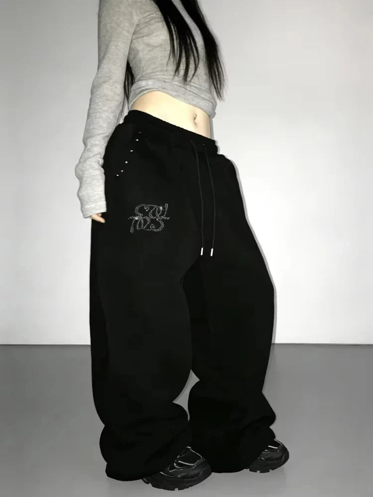 Zwarte wijde joggingbroek voor dames met glitterapplicatie