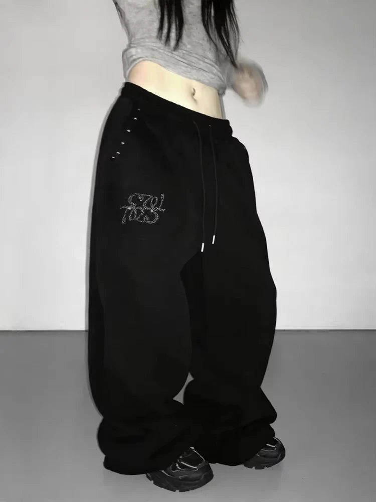 Zwarte wijde joggingbroek voor dames met glitterapplicatie