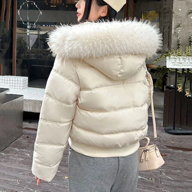 Kurze Damen Pufferjacke mit Kapuze und Kunstfellbesatz Rosa