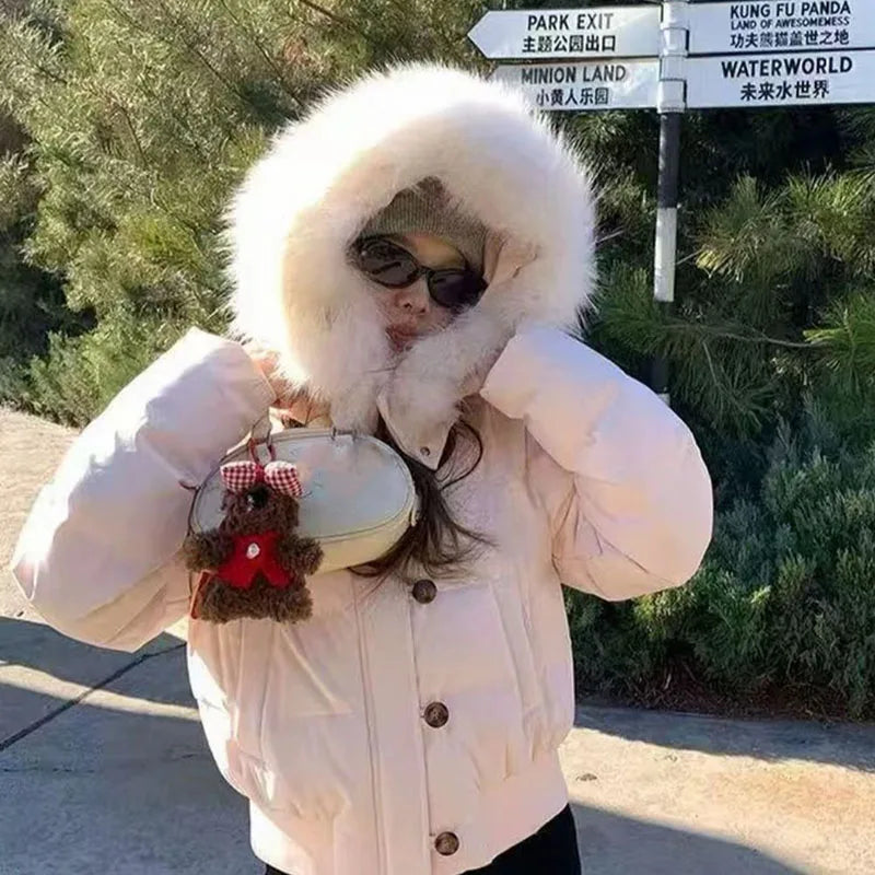Kurze Damen Pufferjacke mit Kapuze und Kunstfellbesatz Rosa