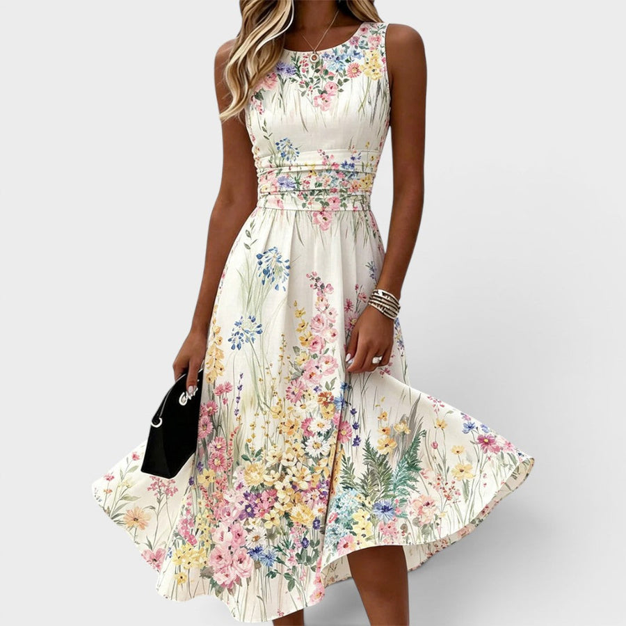 Witte mouwloze dameszomerjurk met bloemenprint en ronde hals