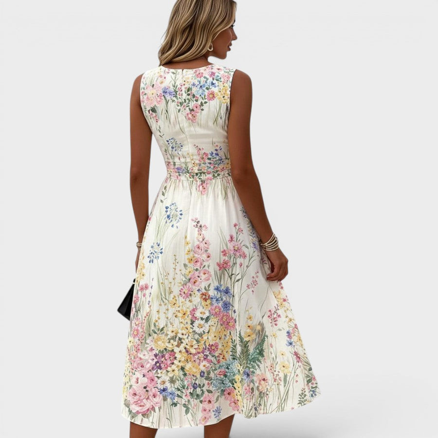 Witte mouwloze dameszomerjurk met bloemenprint en ronde hals