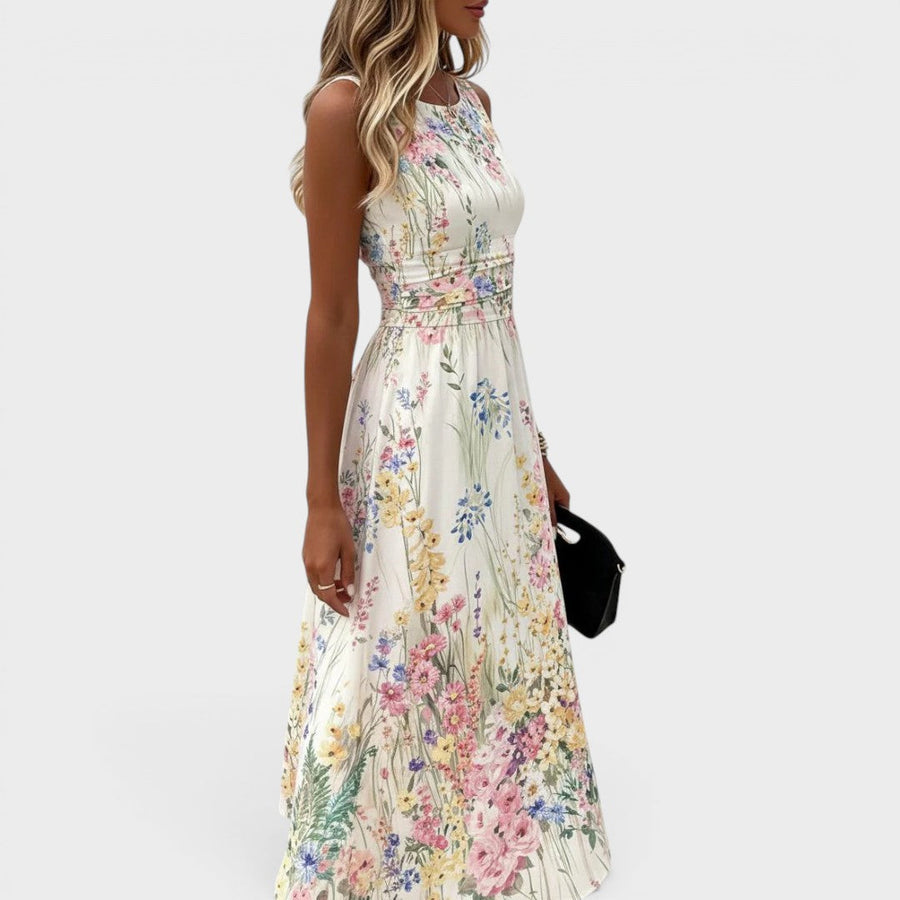Witte mouwloze dameszomerjurk met bloemenprint en ronde hals
